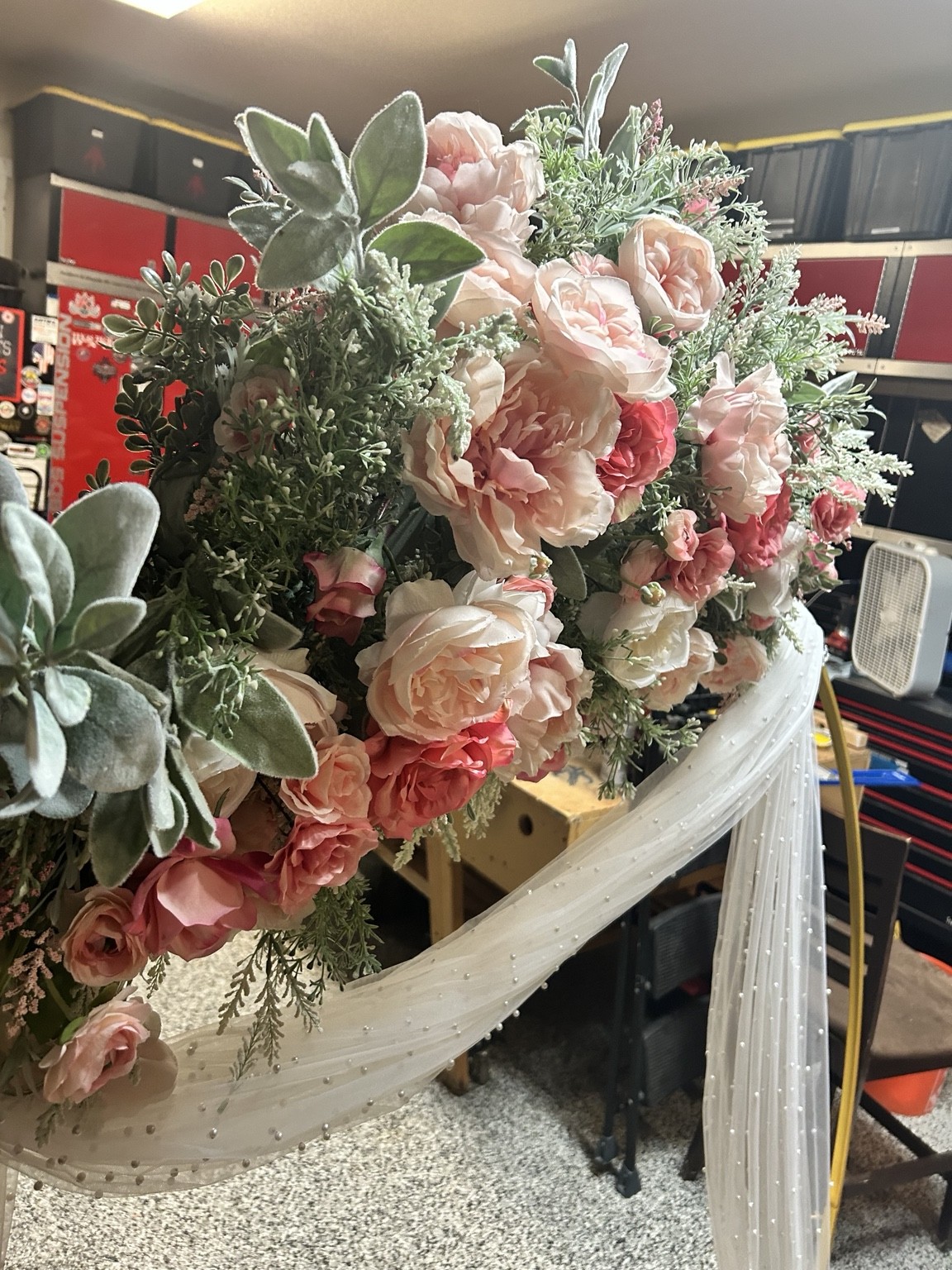 Pink and cream floral arrangement with greenery